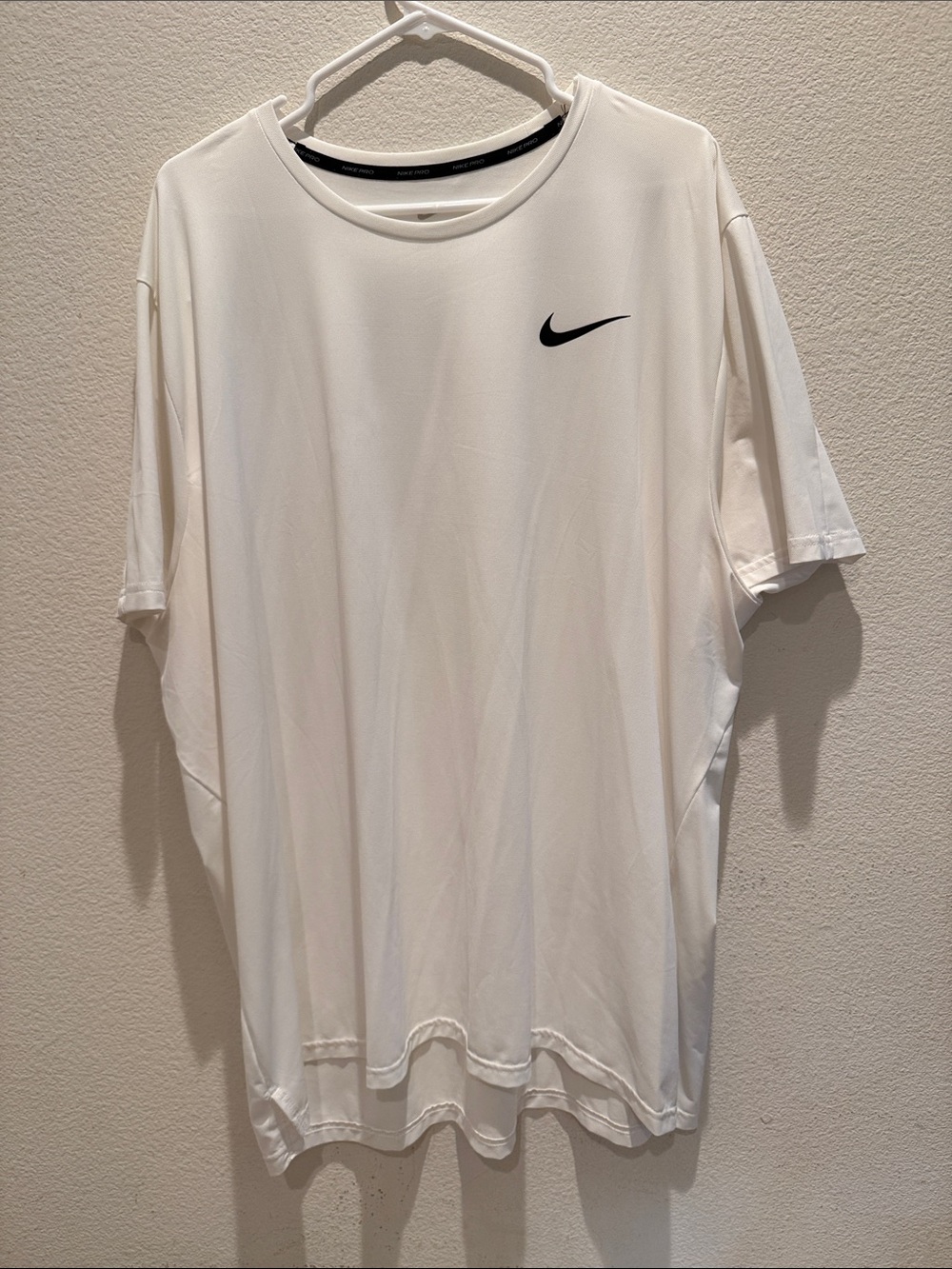 Nike White Short-Sleeve Performance Tee with Black Swoosh